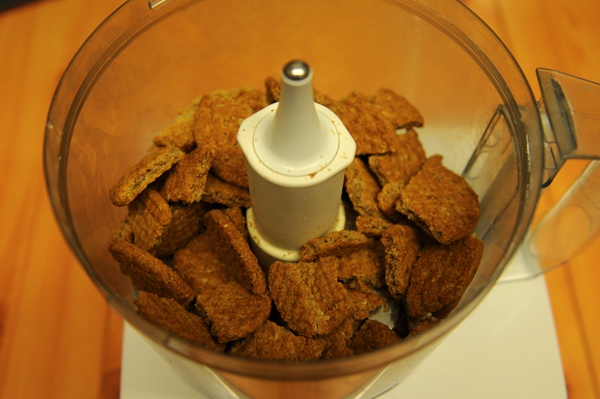 Blitz the Hobnobs in a food processor