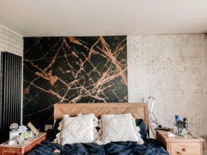 Putting up bedroom wallpaper
